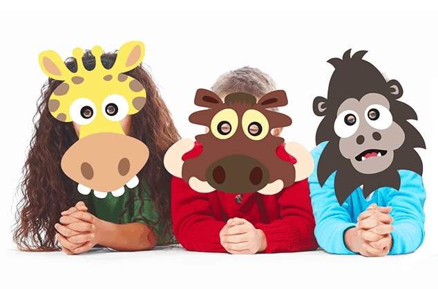 Three children holding up fun printable animal masks